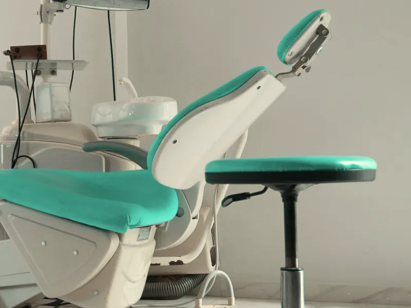The treatment chair and the doctor's stool.