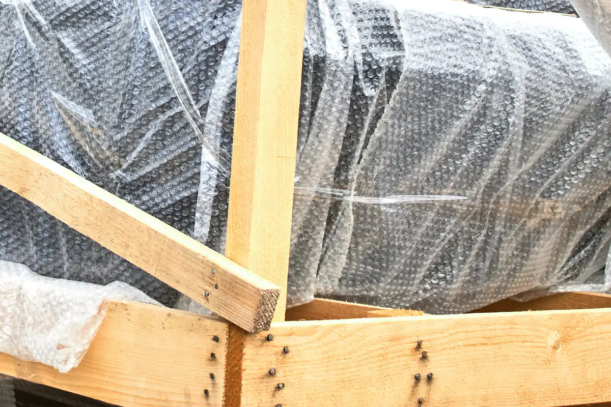 A piece wrapped and crated in timber, ready for the van.