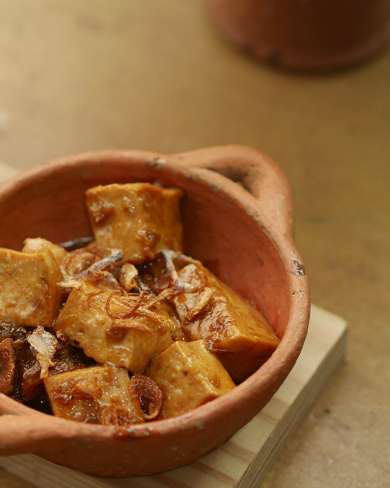 Double ka meetha in a clay dish, the fried bread glossy with syrup.